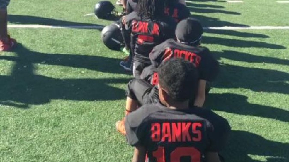 Las Vegas youth football team takes knee during National Anthem in