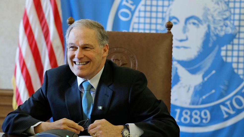 Election 2020 Inslee Jay inslee file desk state flag backdrop AP19060080575126.jpg