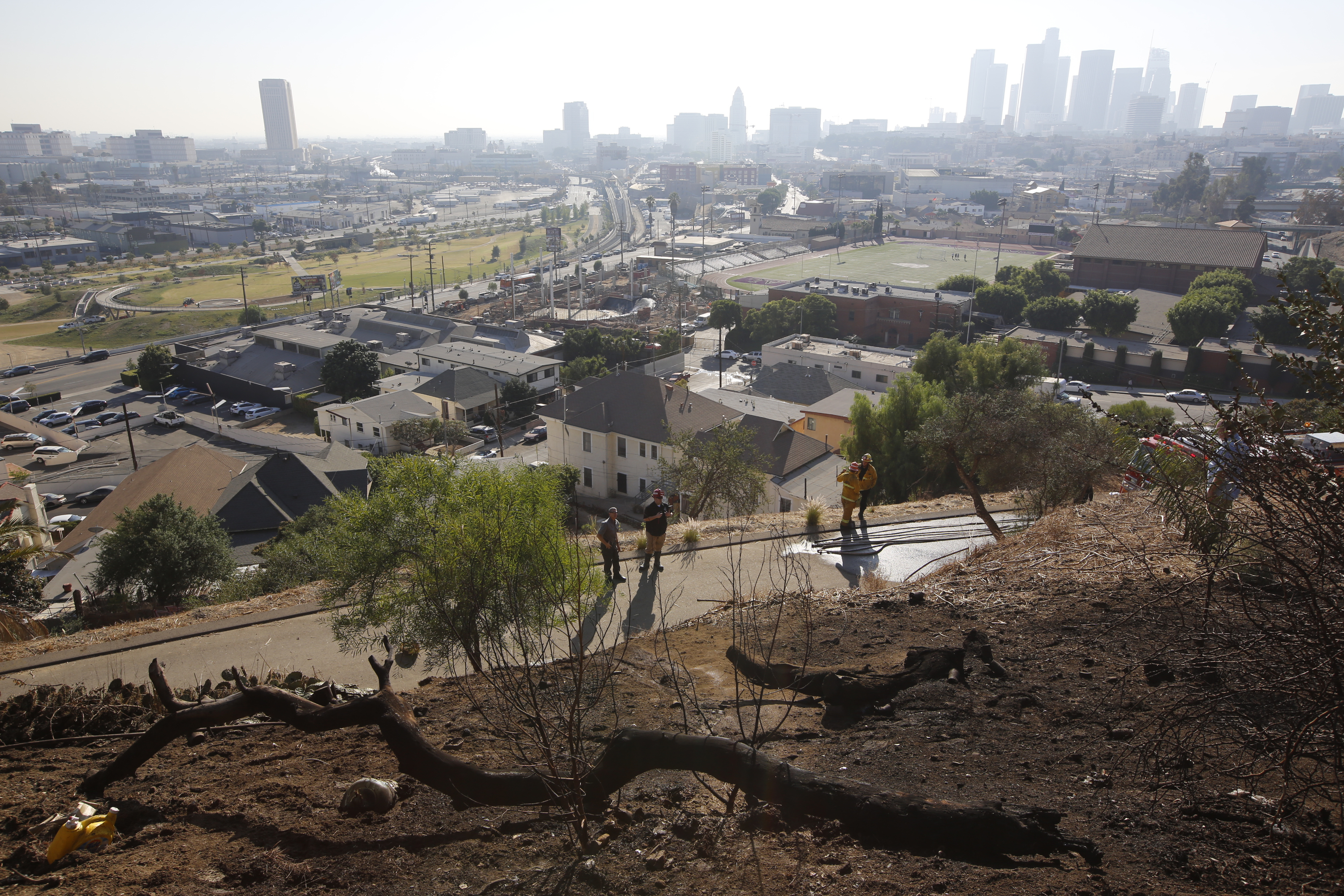 burned out homeless camp after a brush fire erupted in the hills